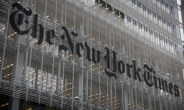 O Times quer cortar custos para investir em futuro digital da publicação / Foto: Andrew Burton / AFP