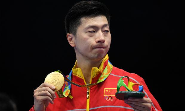 Com o triunfo, Ma Long conquistou seu particular Grand Slam, com o ouro olímpico, o campeonato mundial, a Copa do Mundo e vários títulos de world tour. / Foto: AFP.