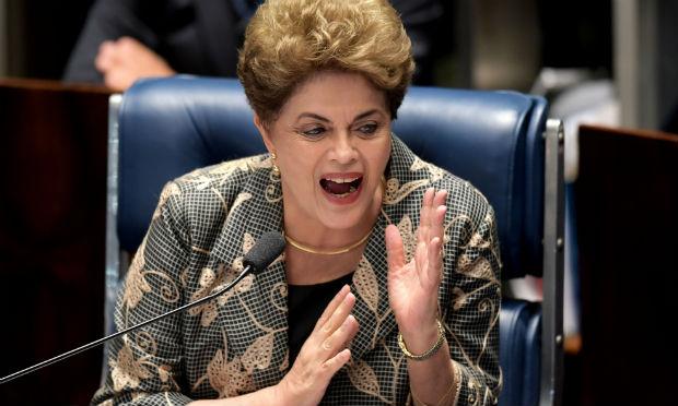 Respondendo a uma pergunta da senadora Lídice da Mata (PSB-BA), Dilma disse que a contribuição de Cunha ao País "foi a mais danosa possível". / Foto: Evaristo Sá / AFP